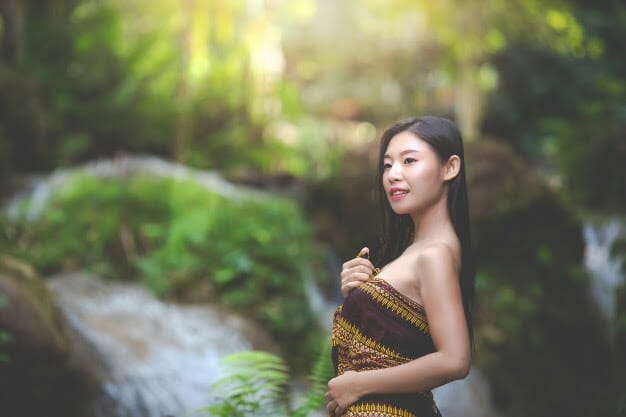 happy bathing asian women natural waterfall